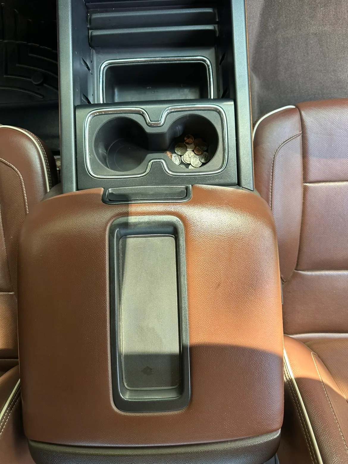 Mold removal: leather truck console, after